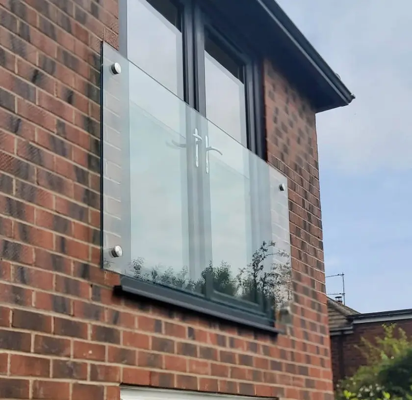 A juliet balcony on upper floor double doors
