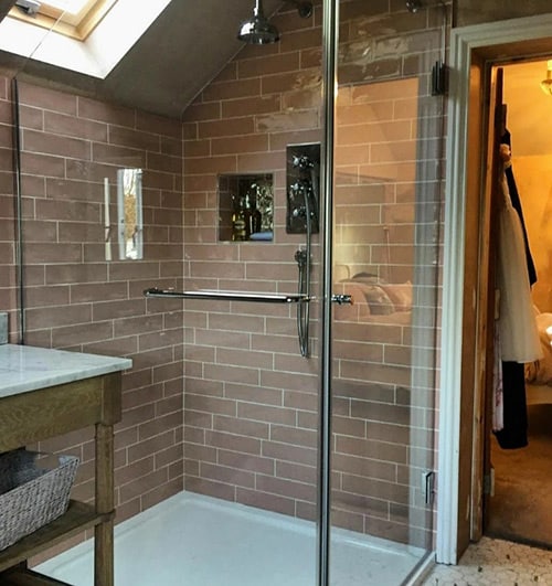 Glass shower screen with stainless steel frame