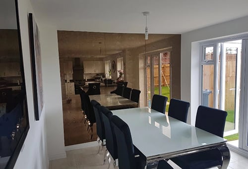 Row of floor to ceiling antique mirrors