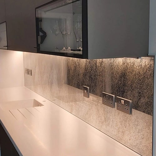 Antique mirror splashback over kitchen countertop