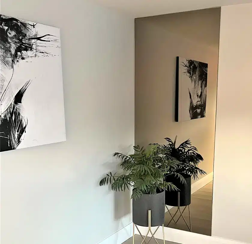 Floor to ceiling bronze custom cut mirror