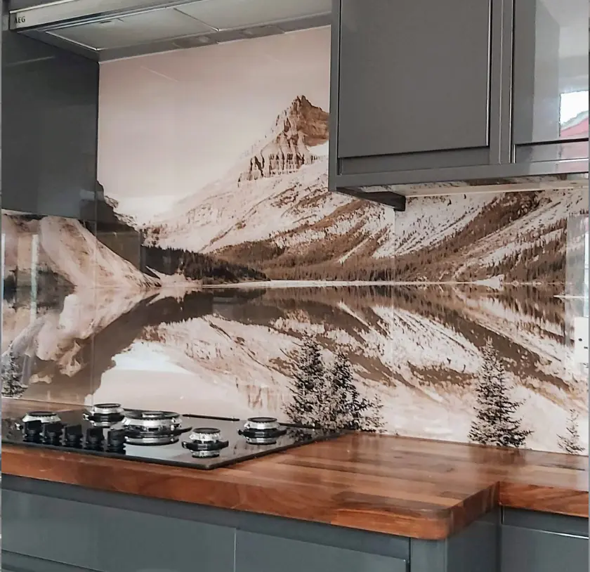 Printed glass splashback of a snowy mountain scene