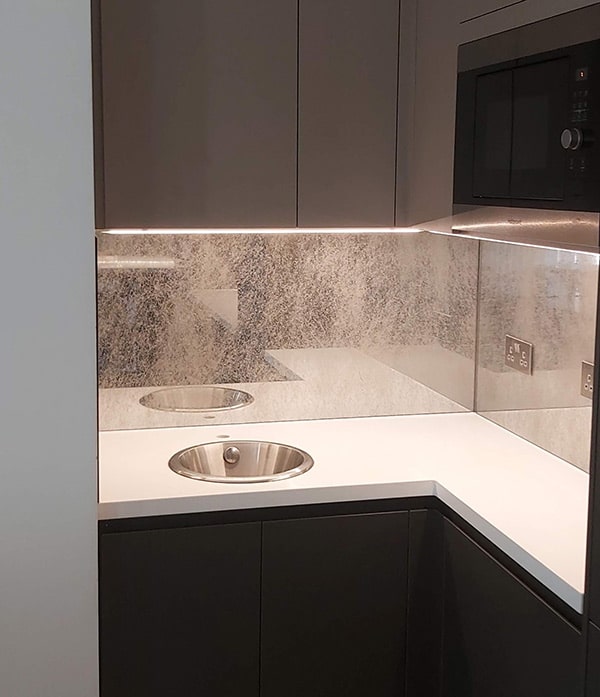 Antique mirror above kitchen countertop