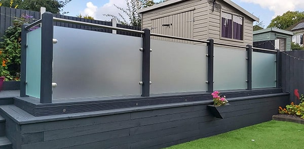 Frosted glass balustrade with wooden posts and stainless steel handrail