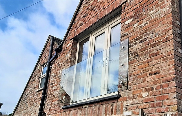 Frameless Juliet balcony with bottom left corner angle cut out