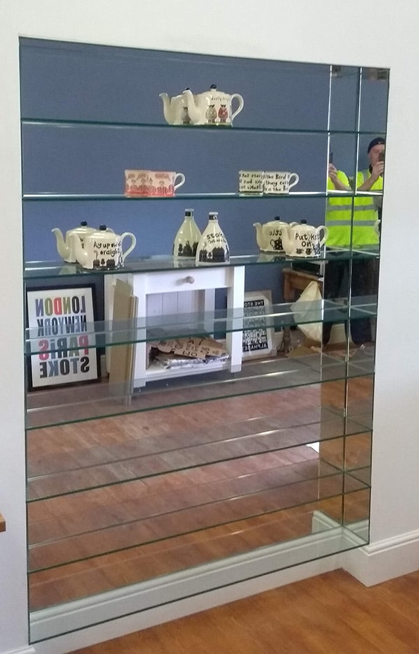 Glass shelving with mirror back
