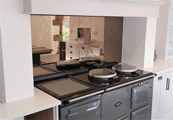 Antique mirror at back of an aga
