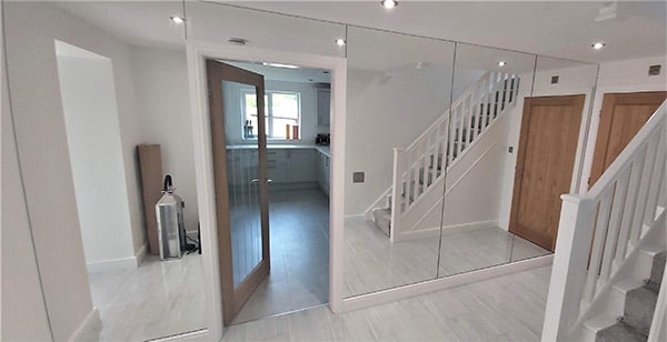 Floor to ceiling mirrors in a hallway