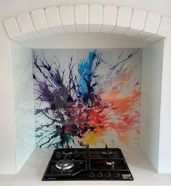 Paint splashes glass splashback above kitchen countertop