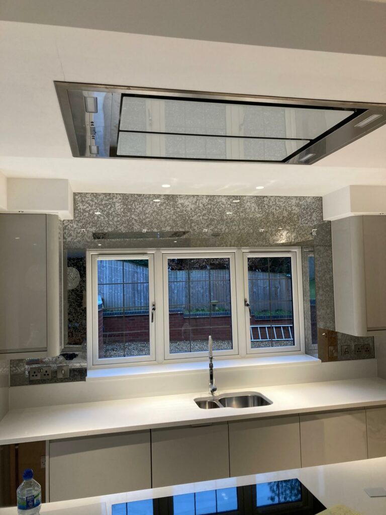 antique mirror splashback around a window frame