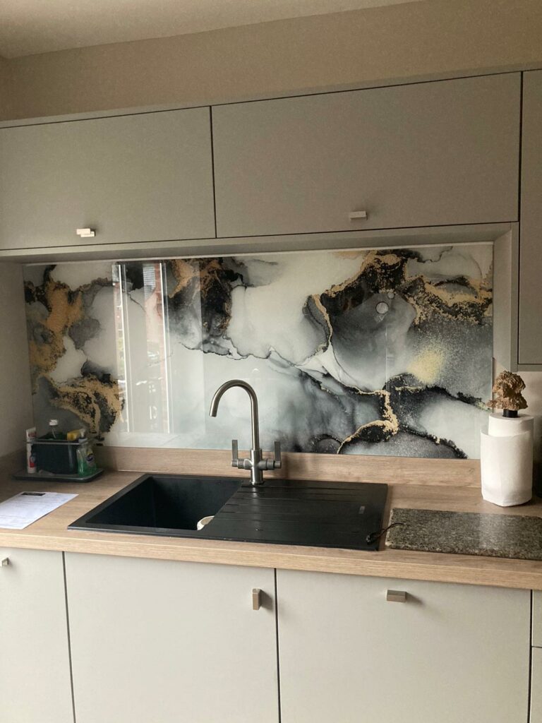 printed splashback of white black and beige swirls resembling abstract ocean waves