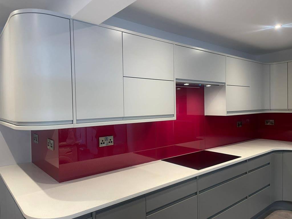 red coloured glass splashback over countertop